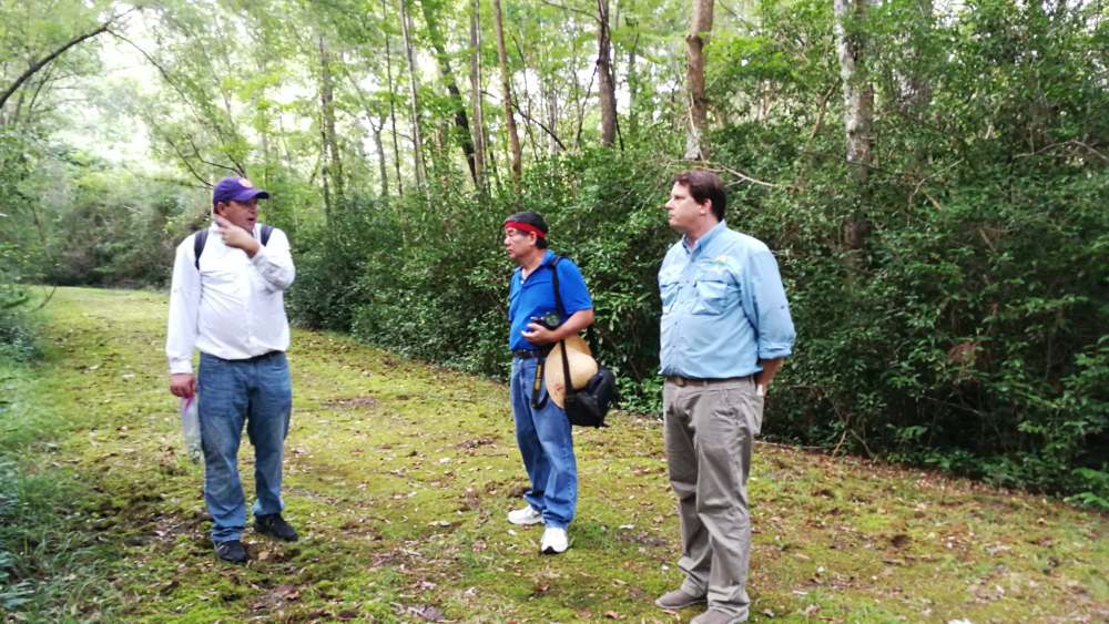 Joshua thomas zhang talking on trail in front of lucky tea
